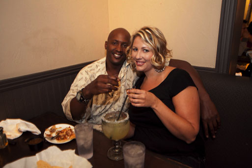 a couple having drinks and food